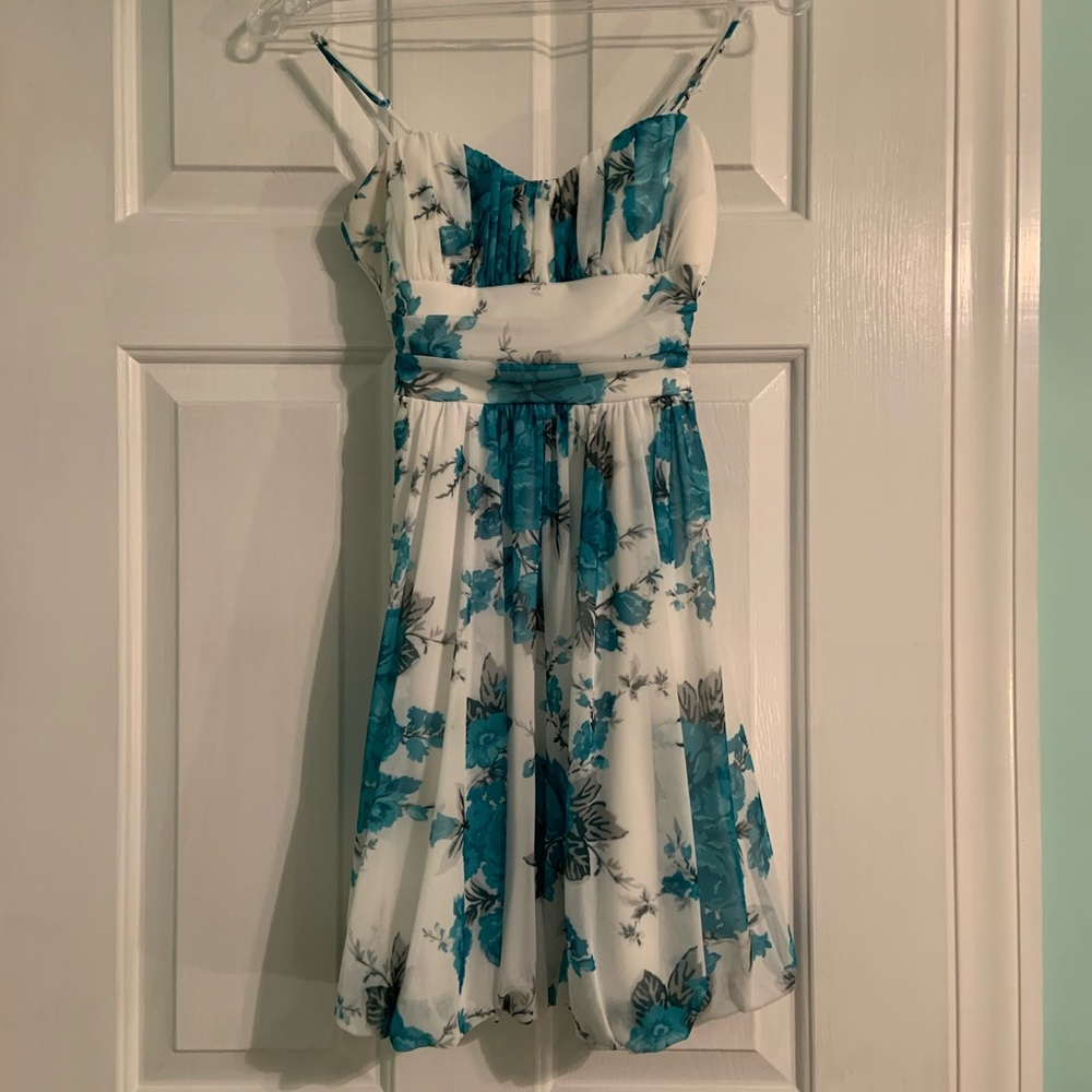 White dress with blue flowers